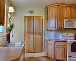 a kitchen remodel with the addition of functional storage space
