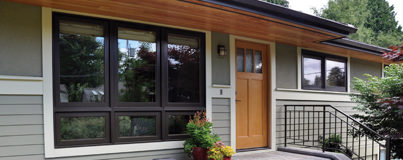 The porch is anchored by a custom steel railing that is duplicated at the sidewalk entry to the home--a unique design feature that really sets this project apart.  All of the wood interiors of the windows were finished with a low-VOC finish--Osmo Polyx Oil.  Other low- and no-VOC finishes were used in other locations