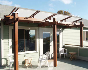 The trellis at the French Doors has a polycarbonate panel over top to provide some protection from rain