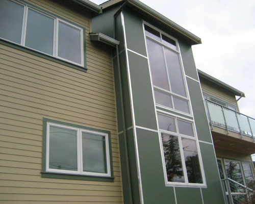 After: Clean lines, obscured glass railings at the master suite deck, and a whole new way of enjoying this Seward Park neighborhood