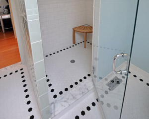 Oversized hexagonal tile defines the room