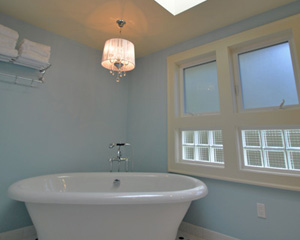And finally, the tub: a cast iron beauty with a chrome riser to fill it.  The train rack to the left holds towels. It's hard not to imagine relaxing inside the spacious soaker