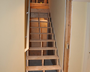 The stairs to the basement also get a remodel.  Formerly described as treacherous, these expanded treads end up navigable and beautiful with some carpet installed
