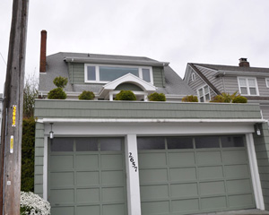 The old facade with hospital green paint and crumbling roofing is gone