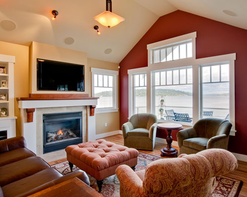 Vaulting the ceiling in this room opens up all the possibilities of Lake Washington living.  Note the expansive view of the lake and Mercer Island through a wall of windows