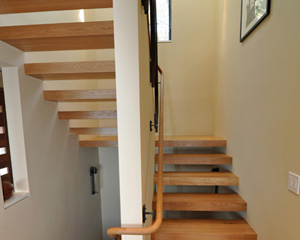 After deliberating about the materials and construction of the treads, the clients settled on white quarter sawn oak to match the new 4 inch planks at the main floor