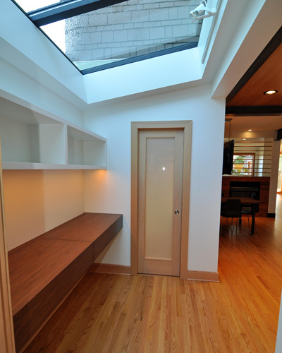 From the laundry room, you can see the powder room door