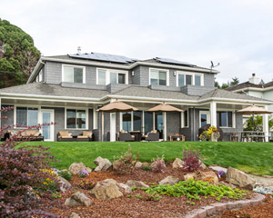 The house also includes an energy recovery ventilation system for good air quality and energy savings, a laundry room up and downstairs, and a powder room at the main level.  It’s a spacious home perfect for an extended family and lots of kids who relish their time at the beach