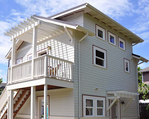 A comfortable flight of exterior stairs provides access to the main living area, with a glass-covered, trellised entry landing.  There's even enough room for a patio chair