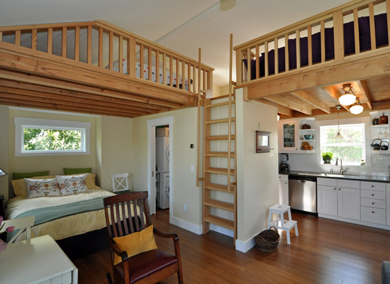 Nearly all of the main floor ceilings are made from exposed tongue and groove fir, which  serves as the flooring for the loft above.  From this level, it's clear that loft access is via the ladder, but how