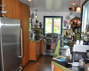 Inside, you can see just how crowded this galley kitchen felt before the addition... a long, narrow hall terminating at the stove