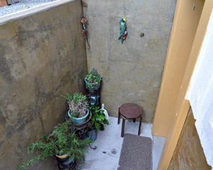 The resident of the new space, who has limited sight, stained the concrete stairs so that the leading edge of the treads are clearly visible. Added lighting in that stairwell ensures that they are safe for her to navigate