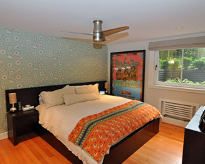 The master bedroom area was also retrofitted, radiator relocated, and a new large egress window added.  The fir floors are original and were refinished.  The basement had been finished partially early in the house's history, with the fir floors installed on a sleeper system.  The downside of that system is that it transmits noise, so we added foam insulation at the walls to stop noise from traveling room to room through the floor
