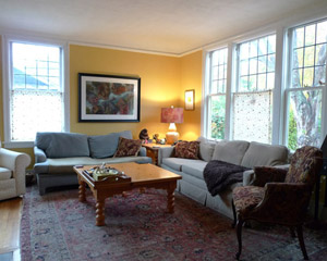 Before: Finishes typical of early 1900s--leaky single-pane windows, coved ceilings and well-worn flooring.   A remodel of these areas was taken into account with the first phase of work done here, setting new floors at the level needed to plane out with new floors in these areas