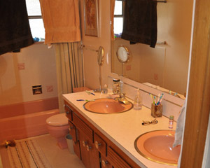 The kids' vanity and counter had seen better days but still held the possibility of being reused, so they were salvaged and donated to ReStore.   This room required much less extensive demolition because the plaster was in such good shape.  The walls were only opened fully at the tub and surround