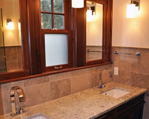 The entry door is still the same from the master bedroom, but what a difference inside!   Double sinks with their own custom medicine cabinets and a sweet new Cherry Creek window to share. Bathroom remodel Seattle