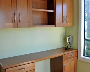 Here and in the kitchen the red oak floors are refinished with Swedish finish.  We also replaced window and door trim and painted in both rooms