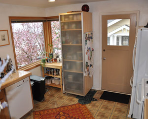 Before: poor window placement blocked the view and a low sill height made for a dead corner - difficult to use effectively. Extensive masonry work was required to correct these problems