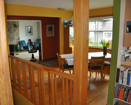 Before: The previous remodel included an oak railing and post--materials and design completely at odds with this mid-century rambler