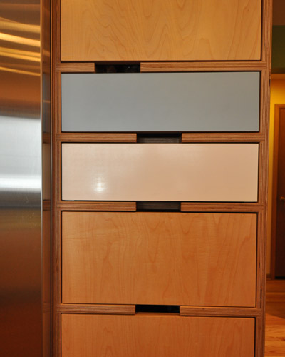 The clients chose Kerf cabinets after buying a coffee table from the company and loving the color and exposed plywood edges