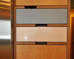 The clients chose Kerf cabinets after buying a coffee table from the company and loving the color and exposed plywood edges