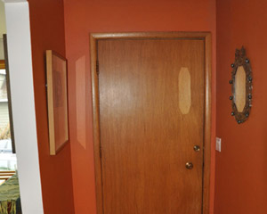 Before: the entry door is delaminating and in need of an update